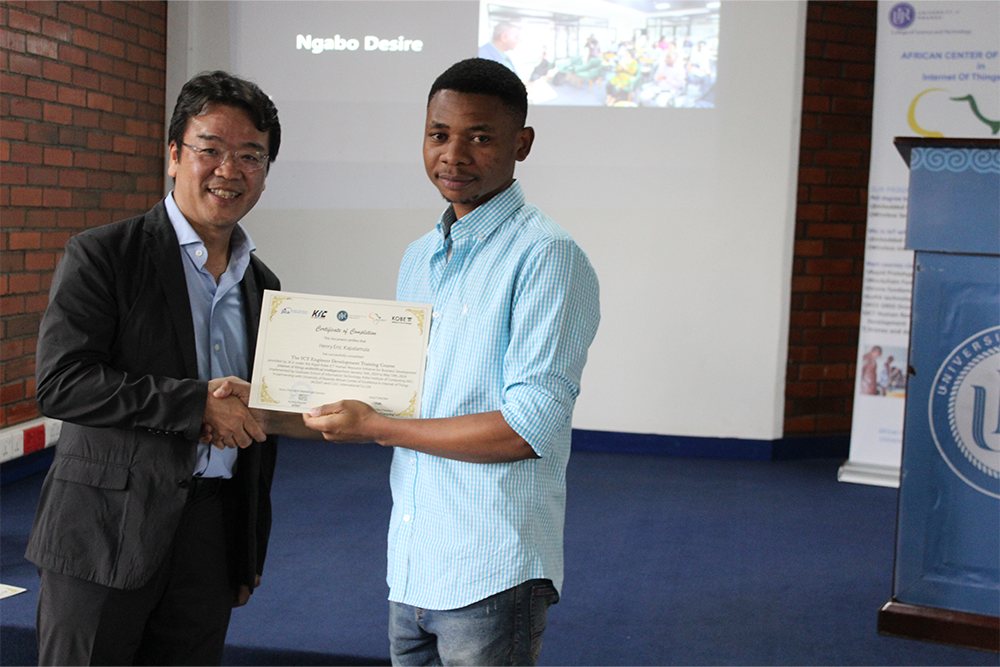 One of trainees receiving a certificate after completion of the training