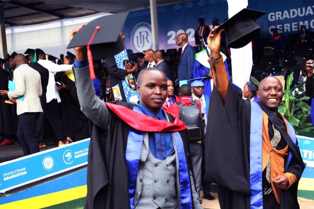 Zephaniah Bizimana and his colleague pose for a photo after the graduation ceremony