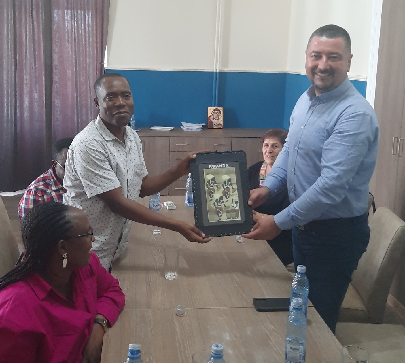 The Rector was very happy when receiving the gift from Rwanda
