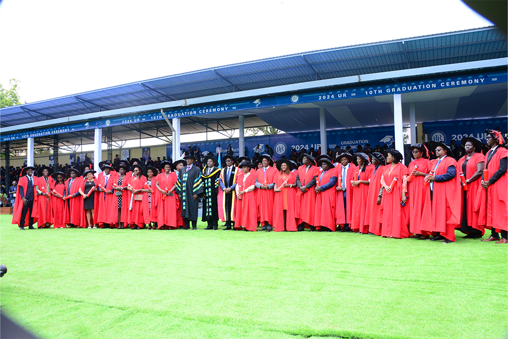 PhD graduates posed with officials for a group photo