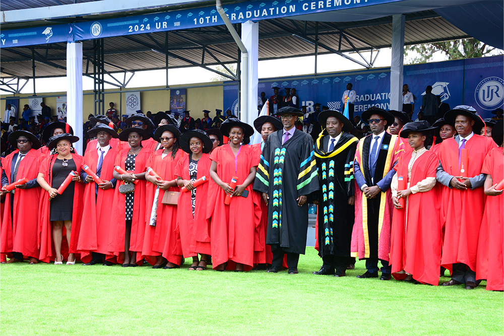 PhD graduates pose with the Prime Minister for the occasion